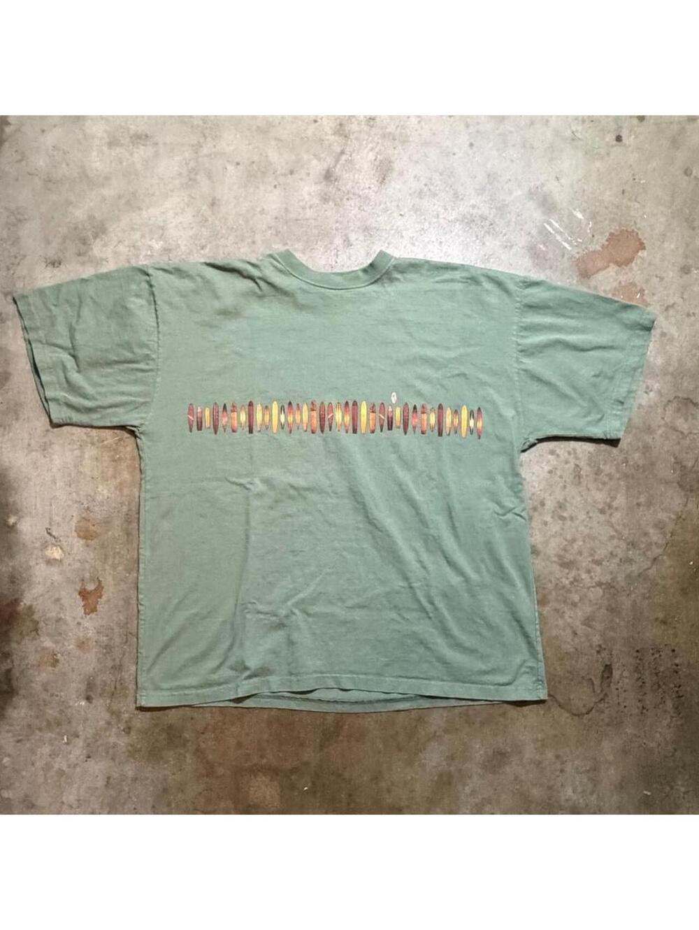 Green Y2K graphic tee with horizontal  graphic of surfboards I think